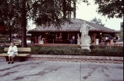 1981-Lake-Buena-Vista-Shopping-Village-Old-Woman-on-bench-with-Statue