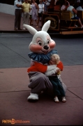 White Rabbit hugs small child