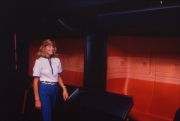 Horizons cast member in front of the ride vehicle/gondola