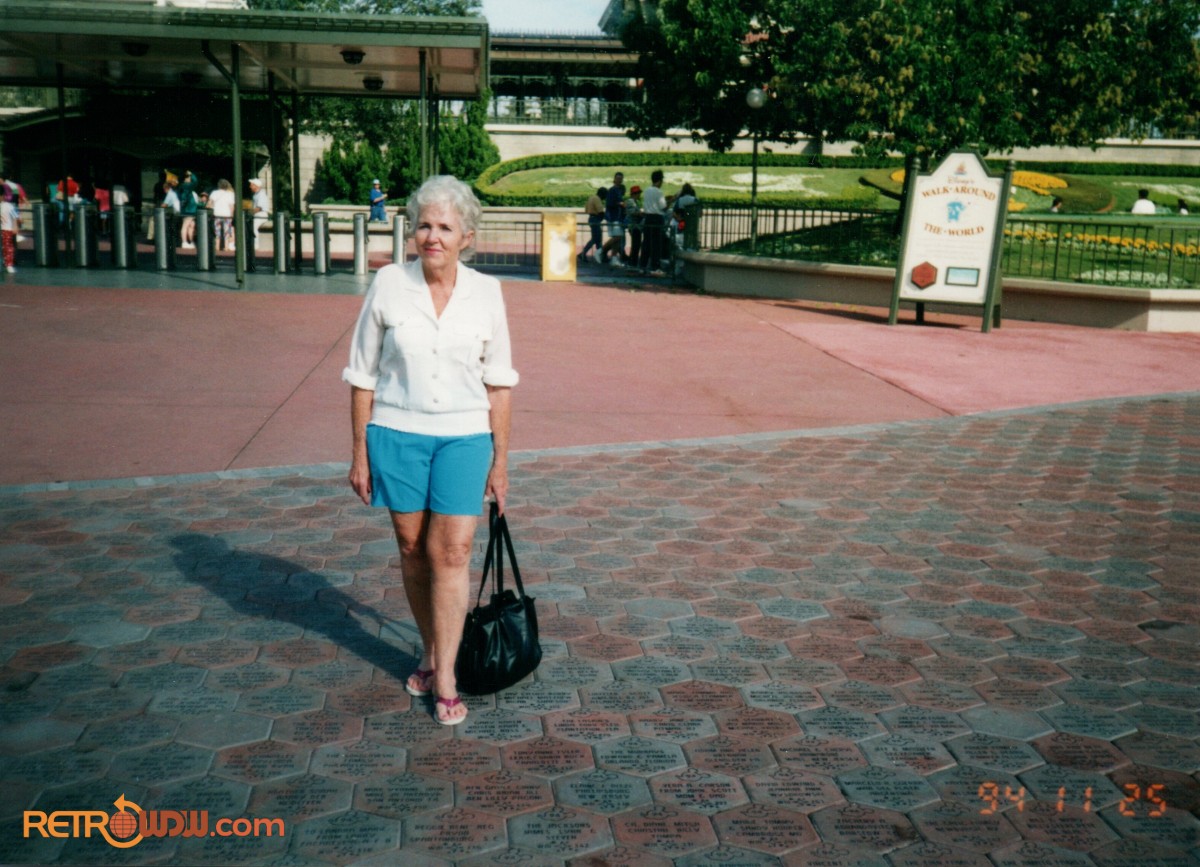 Photo of a woman outside the Magic Kingdom gates, November 25, 1994