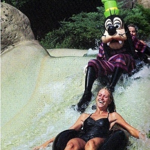 Goofy riding an inner tube on the White Water Rapids