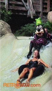 Goofy riding an inner tube on the White Water Rapids