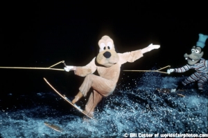 Pluto and Goofy waterskiing at night